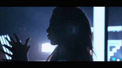 Silhouette Woman Reaching Hand In Dark Room GIF