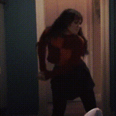 Silhouette Woman Talking On Cell Phone In Hallway GIF