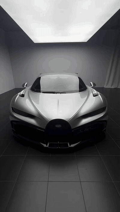 Silver Bugatti Sports Car Parked In Dark Room GIF