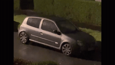 Silver Car Driving On Road With Hedge GIF