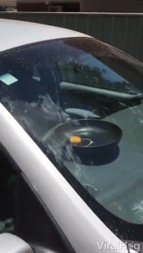 Silver Car With Frying Pan On Windshield GIF