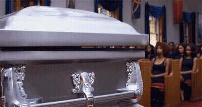 Silver Coffin In Church With Women In Pews GIF