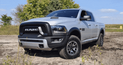 Silver Dodge Ram Truck Parked In Dirt Field GIF