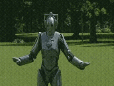 Silver Robot Standing In Field GIF