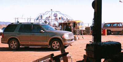 Silver SUV Parked In Dirt Field GIF