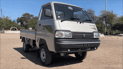 Silver Suzuki Truck Parked In Dirt GIF