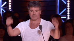 Simon Cowell Ear Plugs With His Fingers GIF
