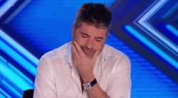 Simon Cowell Trying Not To Laugh