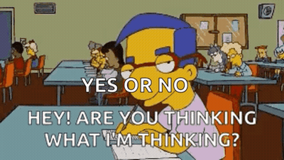 Simpsons Character At Desk With Notebook In Front Of Group GIF