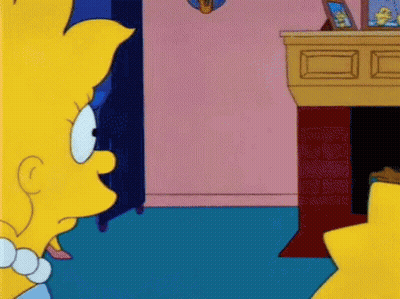 Simpsons Character Sitting By Fireplace GIF