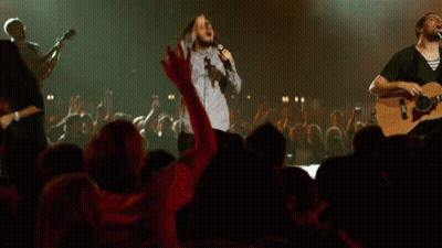 Singer With Microphone And Guitarist GIF