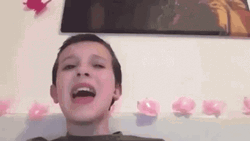 Singing Millie Bobby Brown Flower Background GIF