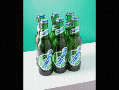 Six Bottles Of Tuborg Beer Are Lined Up In A Row GIF