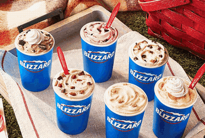 Six Cups Of Blizzard Ice Cream With Different Flavors GIF