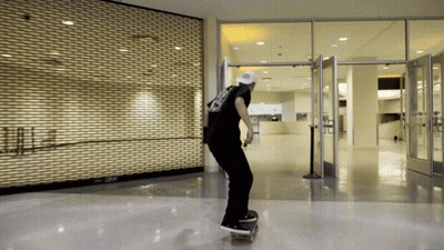 Skateboarder Doing Trick In Front Of Closed Store GIF