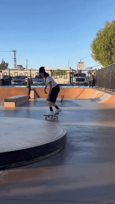 Skateboarder Doing Trick on Ramp