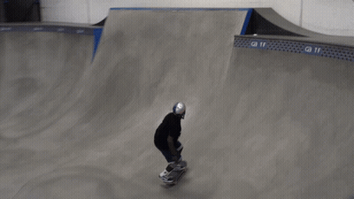 Skateboarder Doing Trick On Ramp In Front Of GMT Sign GIF