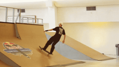 Skateboarder Doing Trick on Ramp Saying Red Bull