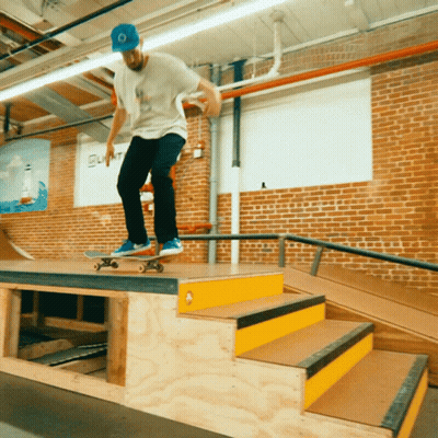 Skateboarder Doing Trick On Ramp With Summit GIF
