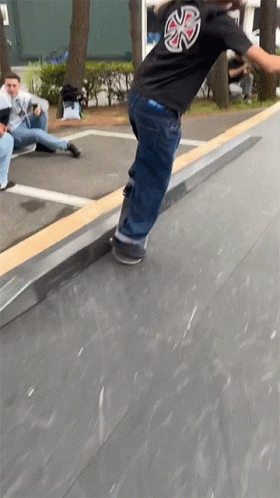 Skateboarder In Black Indy Shirt Doing Trick GIF