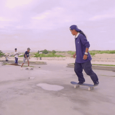 Skateboarder in Purple Adidas Shirt