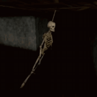 Skeleton Hanging From Ceiling In Dark Room Video Game GIF