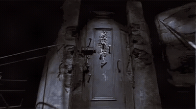 Skeleton Hanging On Door GIF