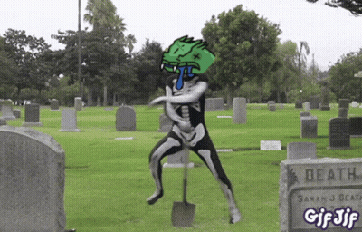 Skeleton Holding Shovel In Cemetery GIF