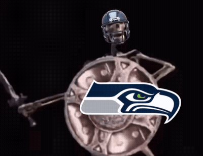 Skeleton In Seahawks Helmet Holding Sword And Shield GIF