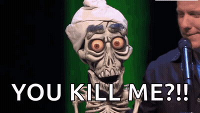 Skeleton Puppet Standing Next To Man With Microphone Saying You Kill Me GIF