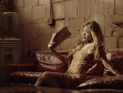 Skeleton Sitting In Chair With Lamp On Head GIF