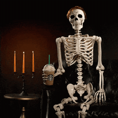Skeleton Sitting On Couch Drinking From Cup With Straw GIF