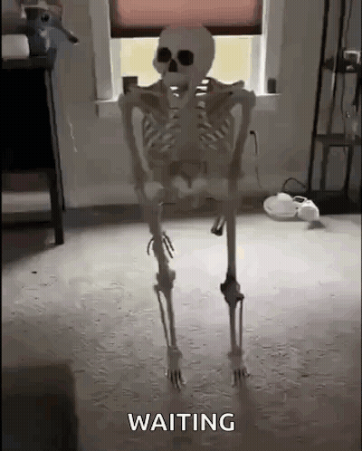 Skeleton Standing In Room Waiting GIF