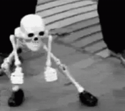 Skeleton With Crutches On Wooden Floor GIF