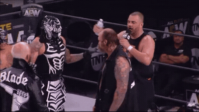 Skeleton Wrestler Talking To Another Wrestler GIF