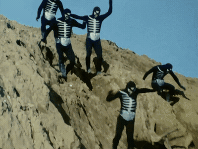 Skeletons Climbing Sandy Hill GIF