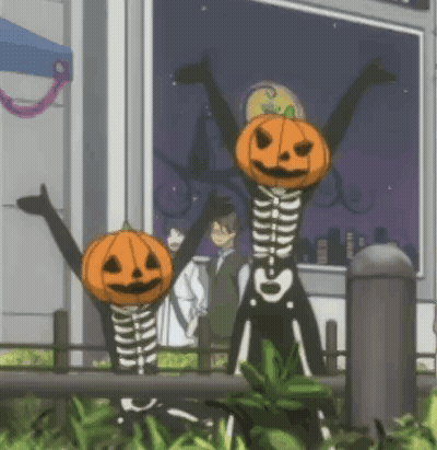 Skeletons With Pumpkin Heads Standing In Front Of Building GIF