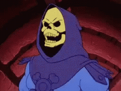 Skeletor From The Masters Of The Universe Is Wearing A Purple Cape And Hood . GIF