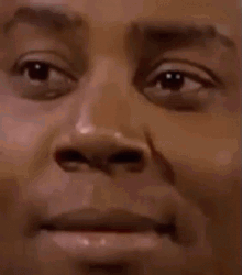Skeptical Kenan Thompson Squinch Close Up GIF