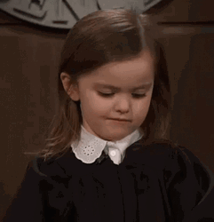 Skeptical Little Girl Smirking GIF