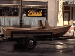 Skiff Parked On Street People Passes By GIF
