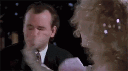 Slapping Scrooge GIF