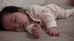 Sleepy Baby Girl Crouching