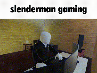 Slenderman Sitting At Desk In Front Of Computer GIF