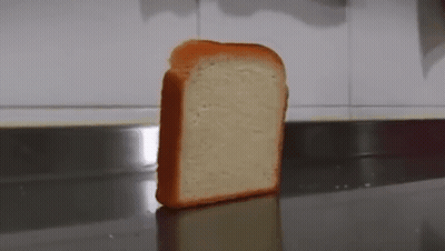 Slice Of Bread On Stainless Steel Counter GIF