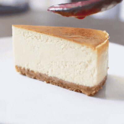 Slice Of Cheesecake With Cherry Sauce GIF