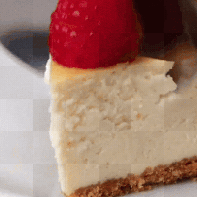 Slice Of Cheesecake With Raspberry GIF