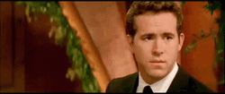 Sly Smile Ryan Reynolds GIF