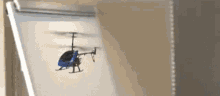Small Blue Helicopter Rotating Fly GIF