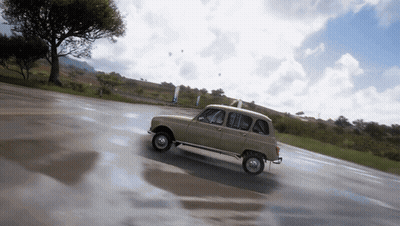 Small Car Driving Down Wet Road GIF